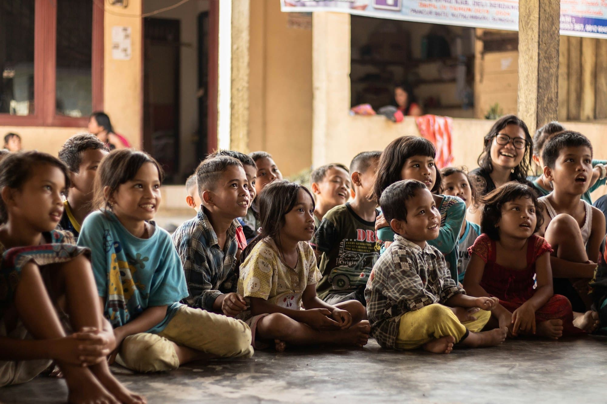 Children sitting together and listening closely